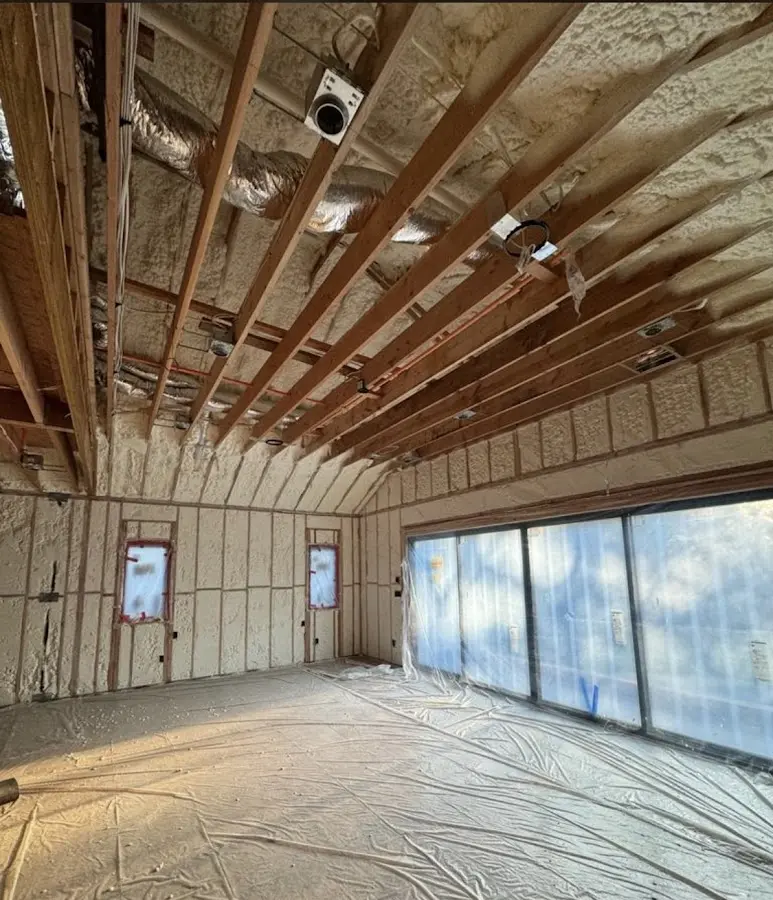 Interior walls and ceiling insulated with spray foam during new construction in Linton